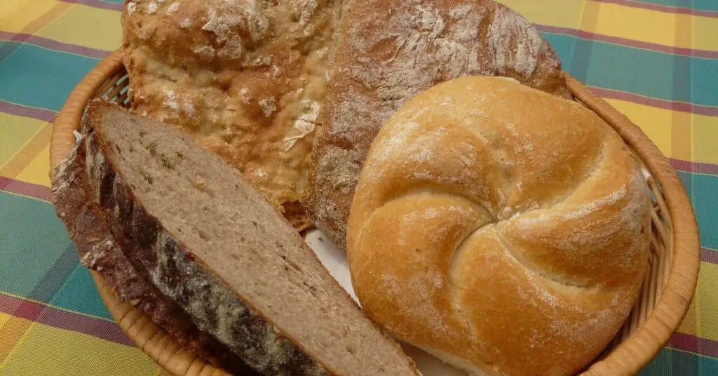 A typical bread basket that Italian restaurants serve, with different types of bread.