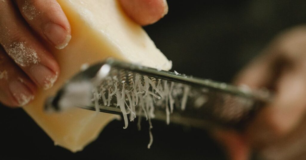 A simple grater with narrow and sharp holes, perfect for grating parmesan or any hard cheese on top of pasta.