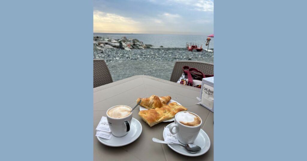 Ligurian breakfast, with focaccia and cappuccino by the sea