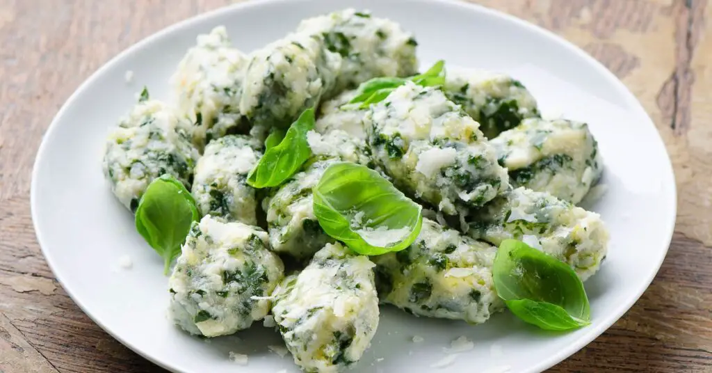 A plate of "Gnudi" gnocchi, which look like vegetable balls but are actually made with the inside of ravioli: spinach, ricotta, Parmigiano-Reggiano, flour, and egg.