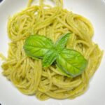 A plate of spaghetti with pesto Genovese.