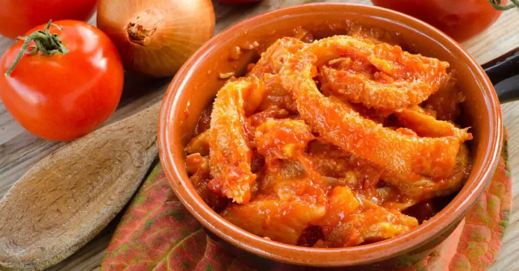 A dishds of tripe cooked with tomato sauce, carrots, celery, onion, garlic, and parsley.