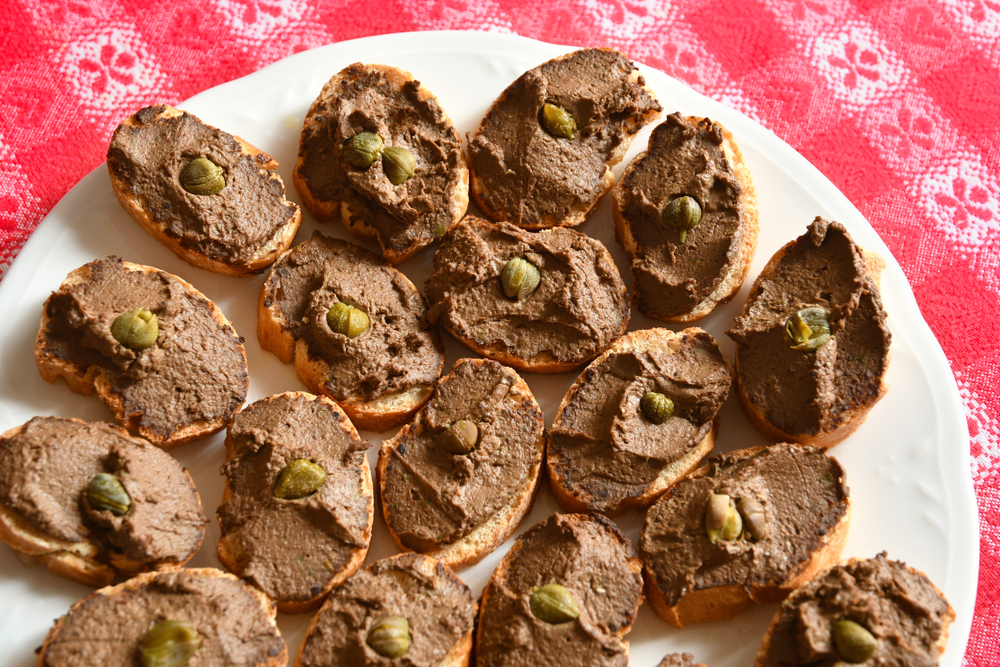 Round dish with Tuscan liver pate croutons.