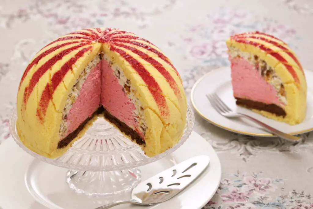 A typical Tuscan cake with a dome shape and a spongy exterior and a creamy interior.