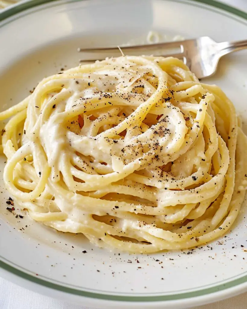Best authentic Italian pasta recipe featuring Cacio e Pepe, a classic Roman dish with spaghetti, pecorino cheese, and black pepper.