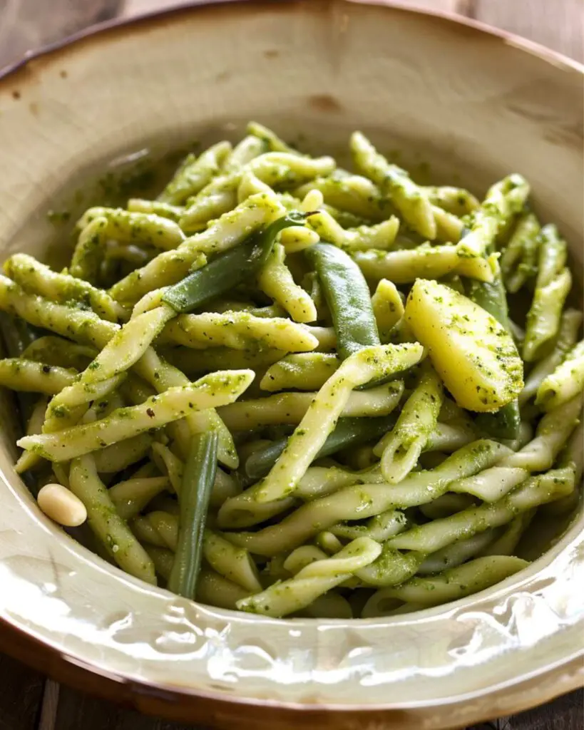 Best Italian pasta recipe featuring Trofie with Pesto alla Genovese, green beans, and potatoes, showcasing a traditional Ligurian dish with fresh basil, garlic, and cheese.