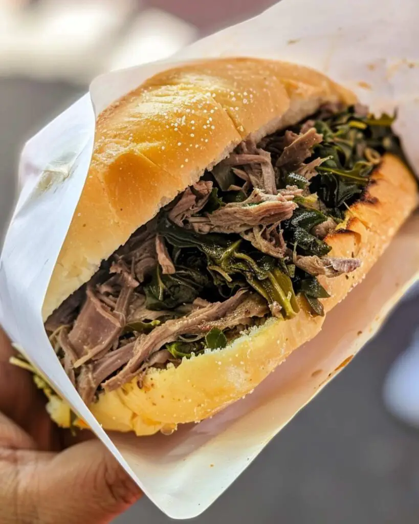 A delicious ciriola sandwich with juicy meat and greens from Mordi & Vai, a top spot for local food in Rome.