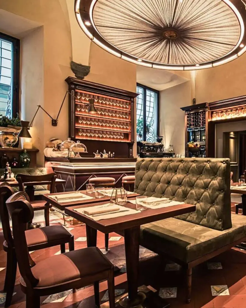 Interior of Cantinetta Antinori, showcasing its elegant dining setup with luxurious seating and historical decor, located in Florence, Italy.