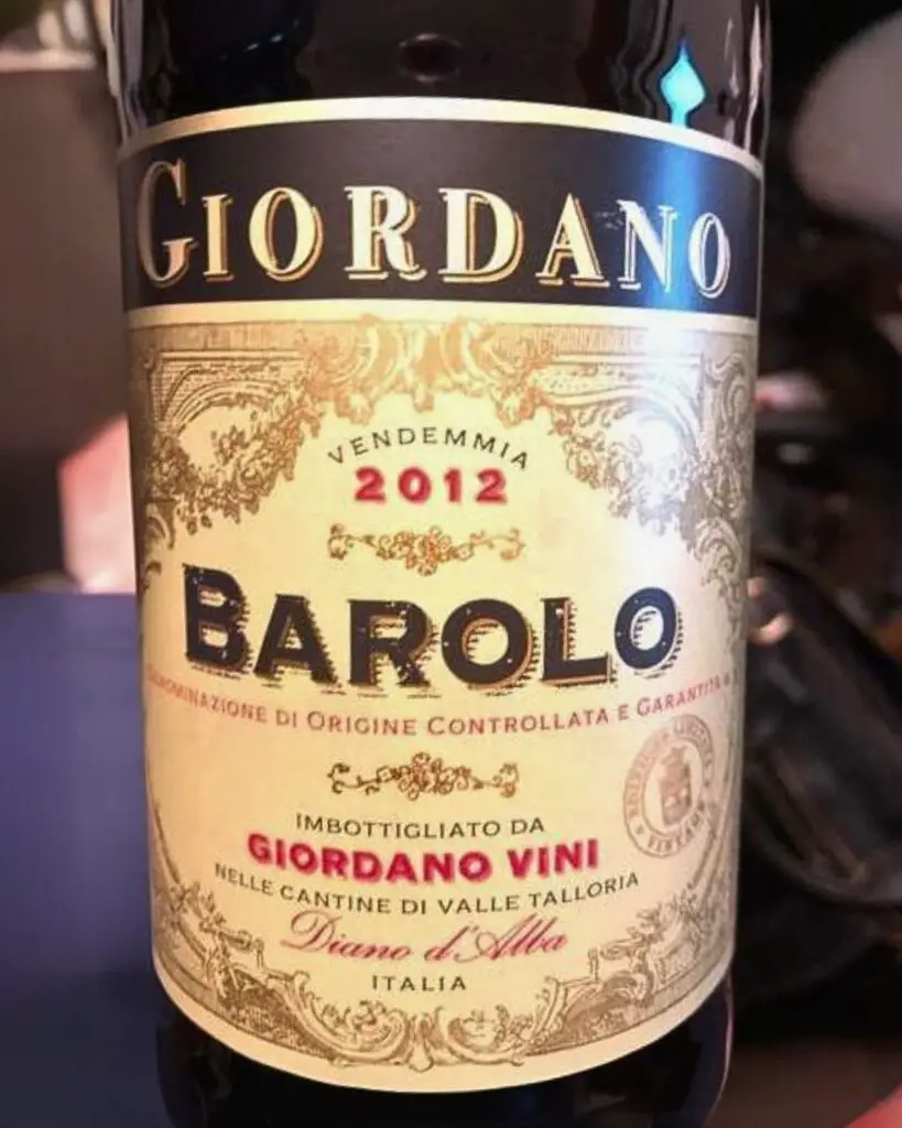 Close-up of Barolo Giordano wine bottle, highlighting the intricate Italian wine label, vintage year 2012, and representing one of the best Italian wines known for its rich flavor and aging potential.