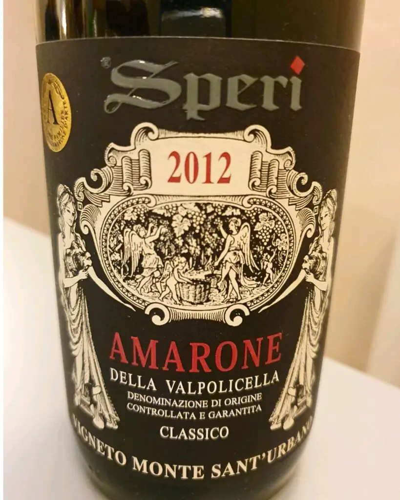 Close-up of an Amarone della Valpolicella wine bottle from Speri, featuring a detailed Italian wine label with vintage year 2012, showcasing one of the best Italian wines known for its rich and complex flavor.