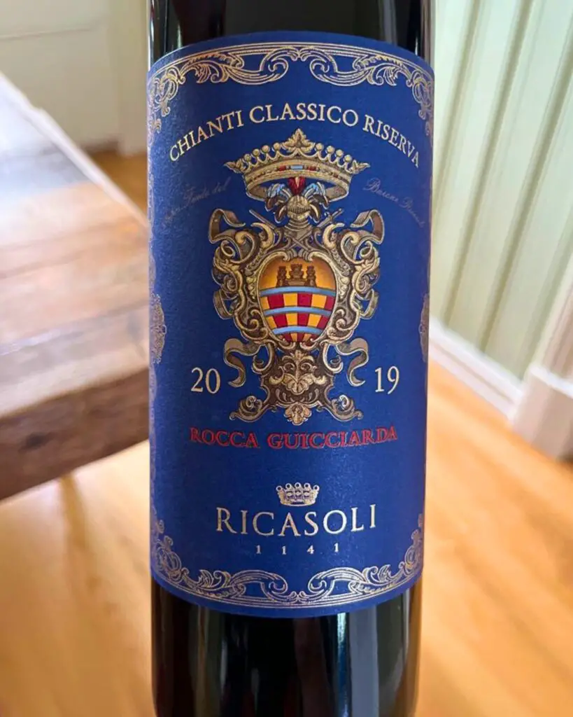 Detailed view of a Chianti Classico Riserva Ricasoli wine bottle, showcasing the intricate Italian wine label, vintage year 2019, and representing one of the top Italian wines with its rich heritage and flavor.