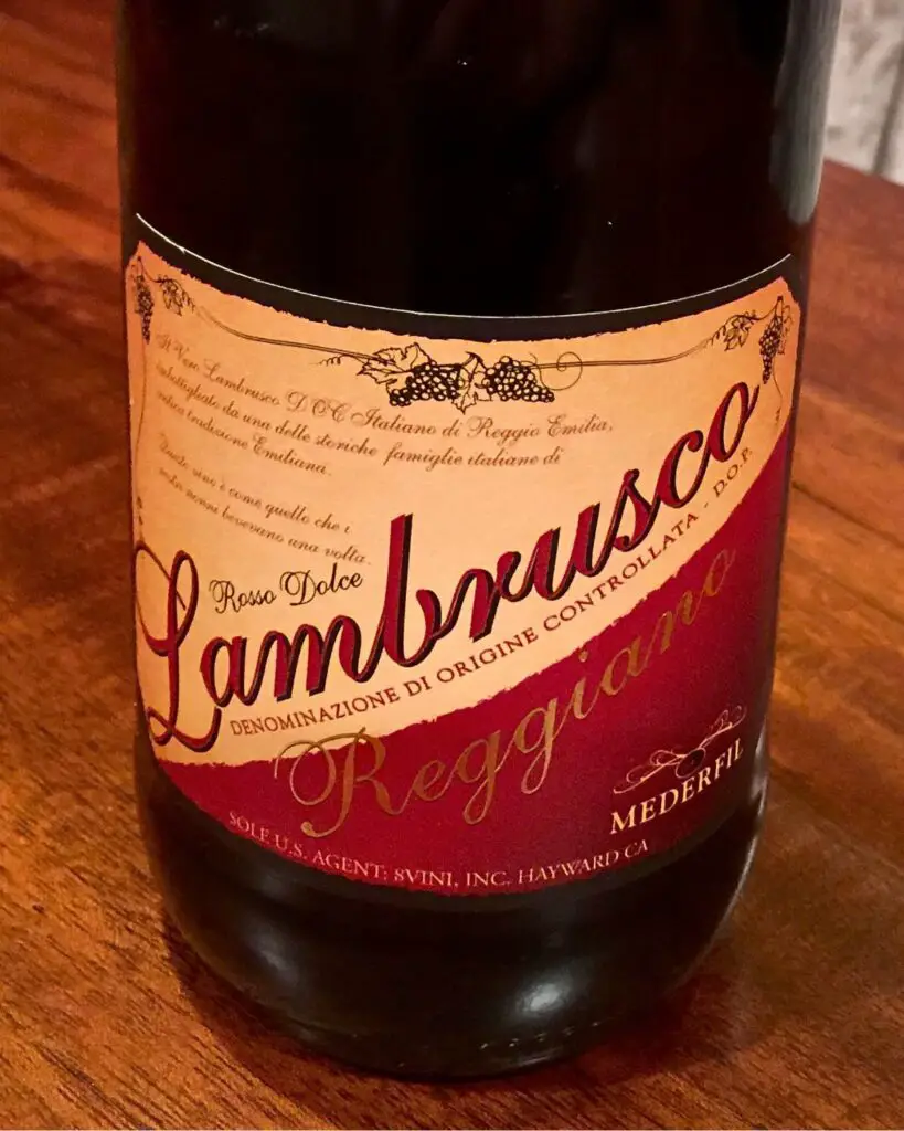 Bottle of Lambrusco Reggiano, featuring an Italian wine label, known for its sparkling red wine qualities and rich Italian wine heritage.