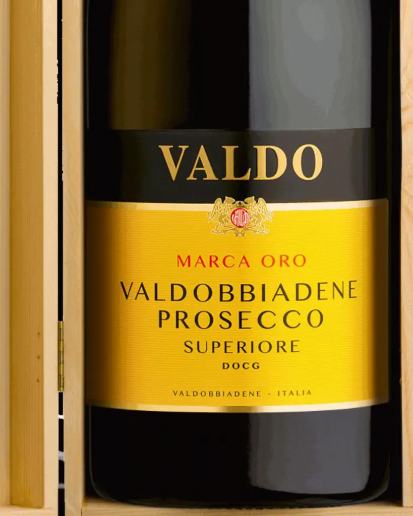 Bottle of Valdobbiadene Prosecco Superiore in an elegant wooden box, showcasing an Italian wine label, representing one of the best Italian sparkling wines.