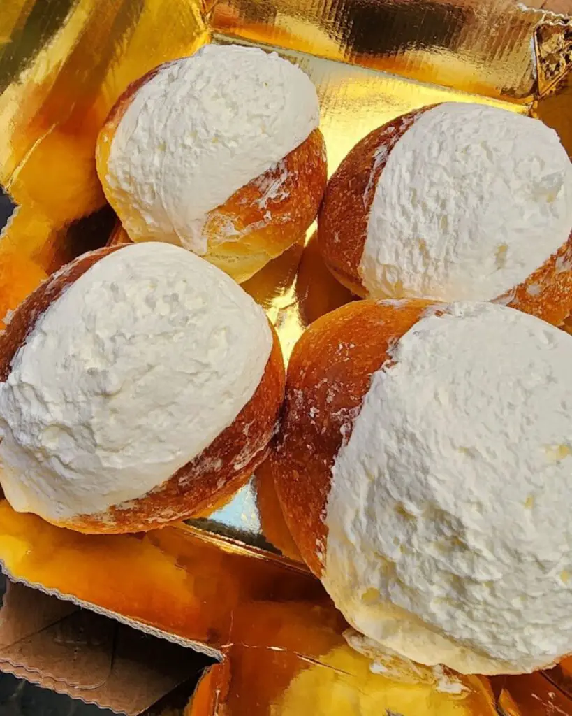 Famous maritozzi from Roscioli Caffè in Rome, topped with fresh whipped cream.