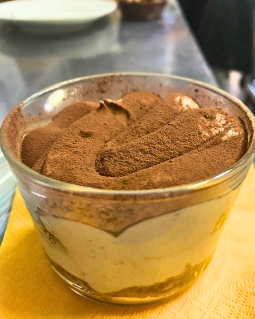 Vegan tiramisu dessert in a glass at Ma Va’, a top vegan restaurant in Rome.