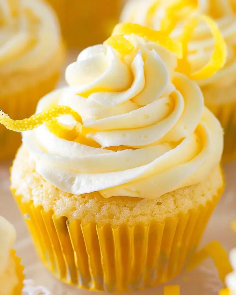 Limoncello cupcakes with a light and fluffy lemon-infused frosting, garnished with lemon zest, showcasing Italian flavored cupcakes and Italian desserts cupcakes.