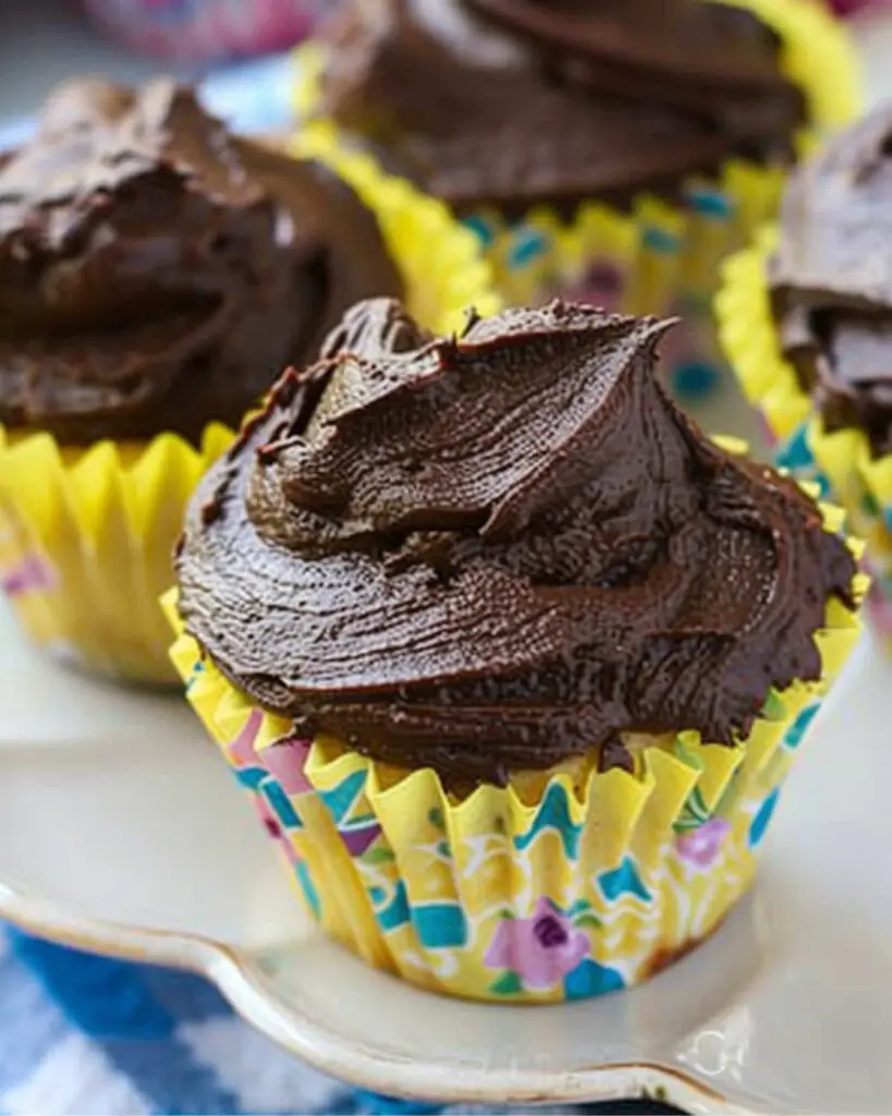 Delicious ricotta and chocolate cupcakes topped with rich chocolate frosting, showcasing Italian cupcakes easy recipe and Italian flavored cupcakes.