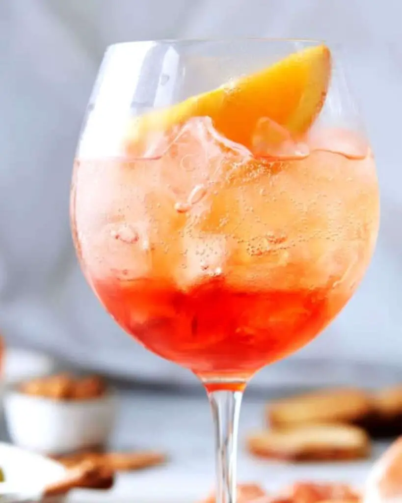 A refreshing Classic Aperol Spritz with ice and an orange slice, perfect for an Italian Thanksgiving cocktail.