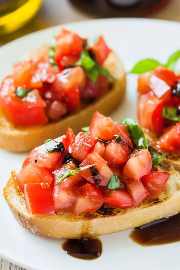 Classic bruschetta with diced tomatoes and basil served on toasted bread