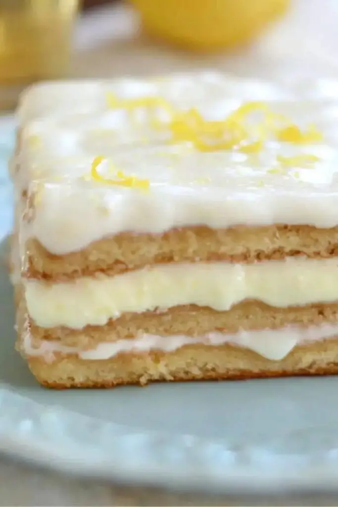 A Limoncello Tiramisu showcasing layers of ladyfingers soaked in limoncello, perfect for an Italian-themed Christmas celebration.