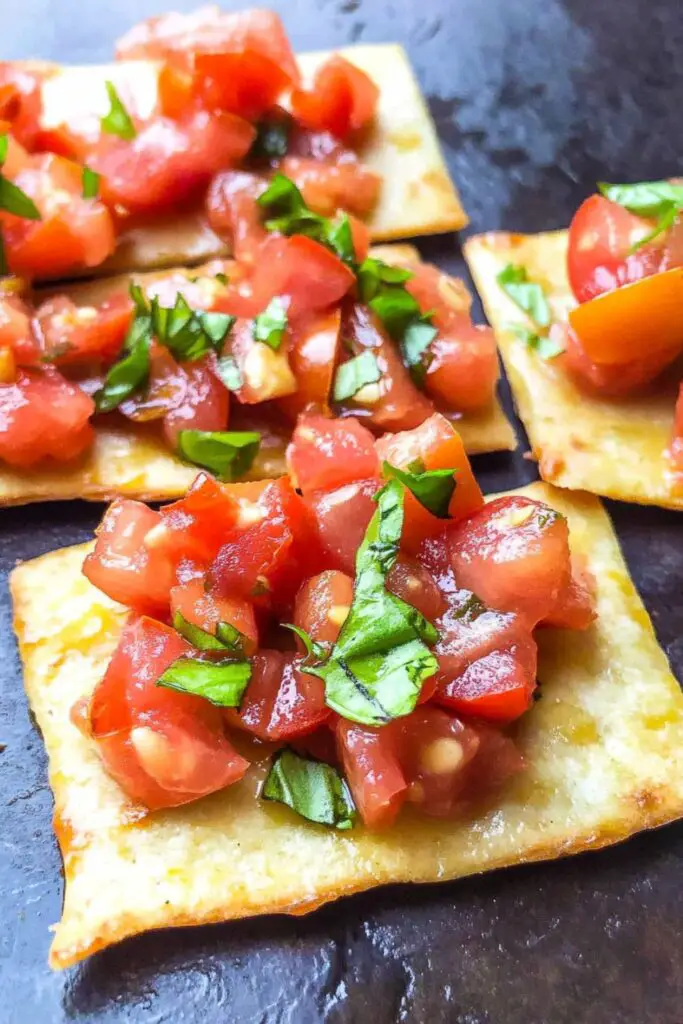 Crispy low carb Lavash bread topped with fresh tomato bruschetta mix of chopped tomatoes, garlic, basil, and olive oil, perfect for a keto-friendly tomato appetizer.