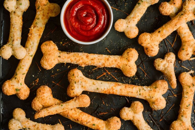 Spine-Chilling Cheesy Halloween Breadstick Bones with Marinara Blood for Dipping