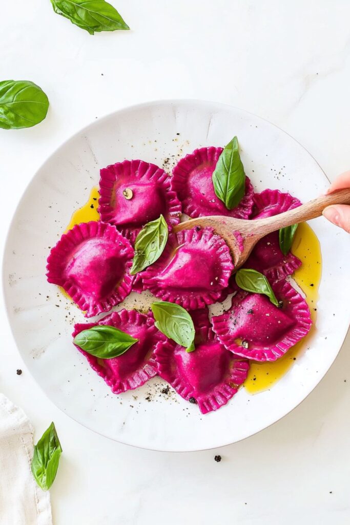 Roasted beet ravioli filled with ricotta, a stunning choice for Valentine's day recipes and cozy romantic meals.