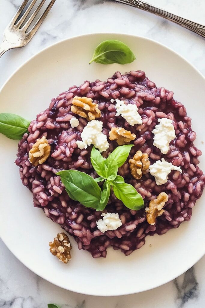 Red wine risotto with goat cheese and candied walnuts, perfect for a romantic classic or Valentine dinner party.