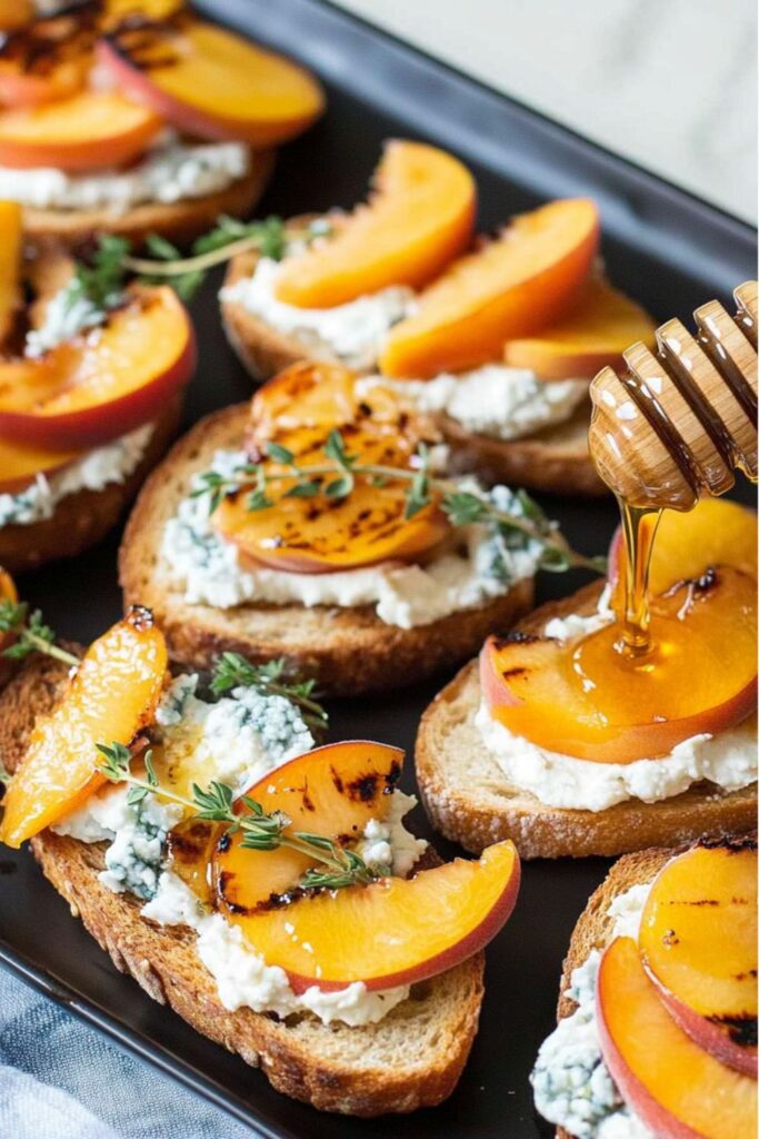 Grilled peach and blue cheese bruschetta drizzled with honey, a great example of Easter Food Appetizers.
