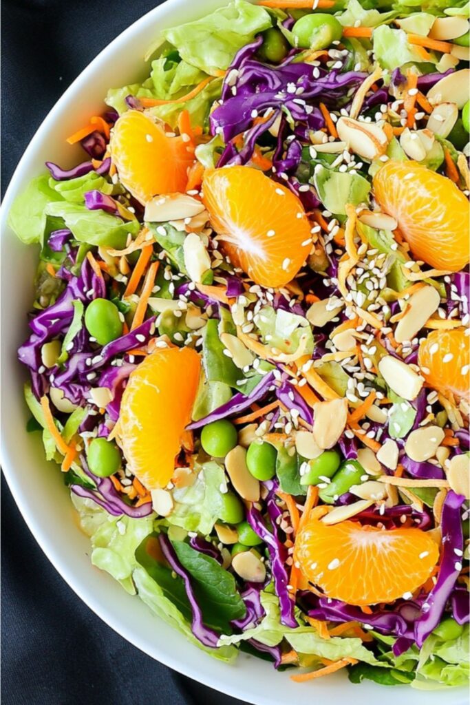 A refreshing mandarin orange and edamame salad, a great example of cookout sides.