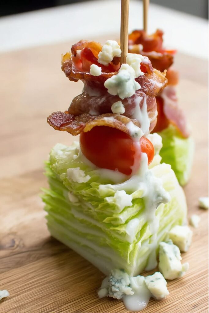 Iceberg lettuce skewers with bacon and blue cheese dressing, perfect as easy bbq sides.