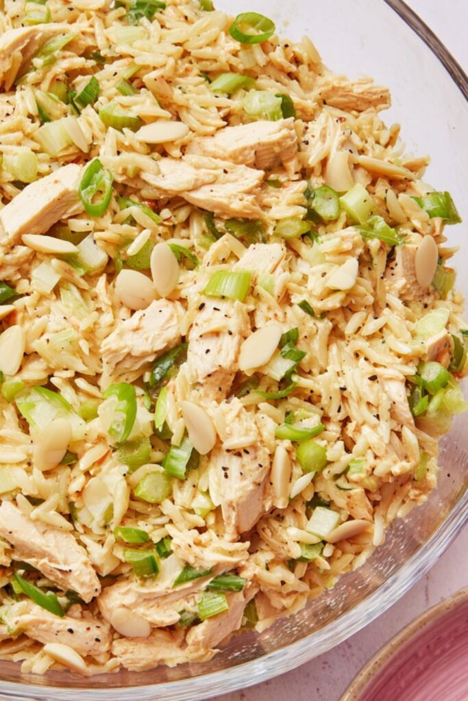 Cold creamy chicken and rice salad with green onions and crunchy water chestnuts.