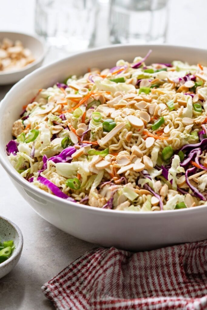 Cabbage slaw mixed with crunchy ramen noodles and topped with slivered almonds