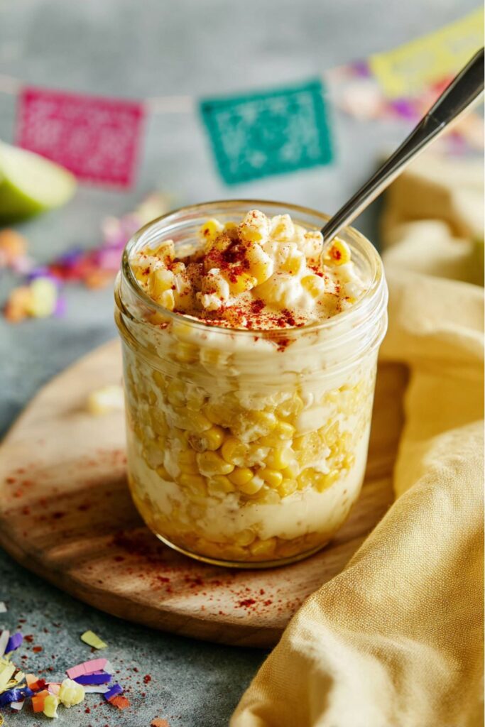 Creamy street corn cup with cheese and chili, tasty Mexican Snacks For Kids.