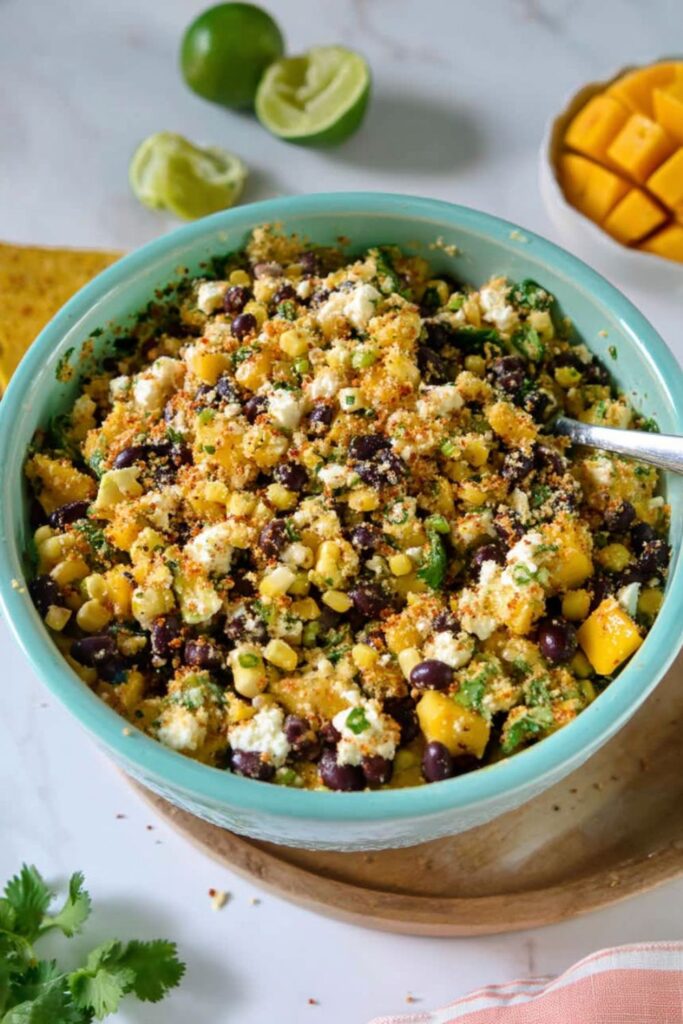 Corn, black bean, mango, avocado salad with feta and cilantro, Fresh Cinco de Mayo dishes.