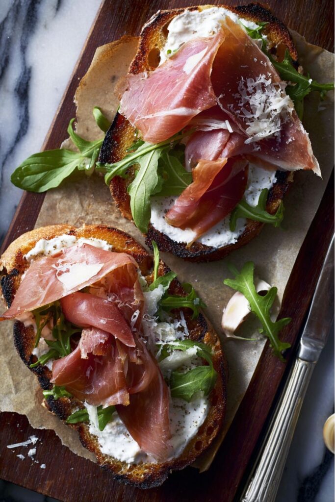 Toasted rustic bread topped with prosciutto and cheese, a standout from an Easy Father’s Day Dinner.