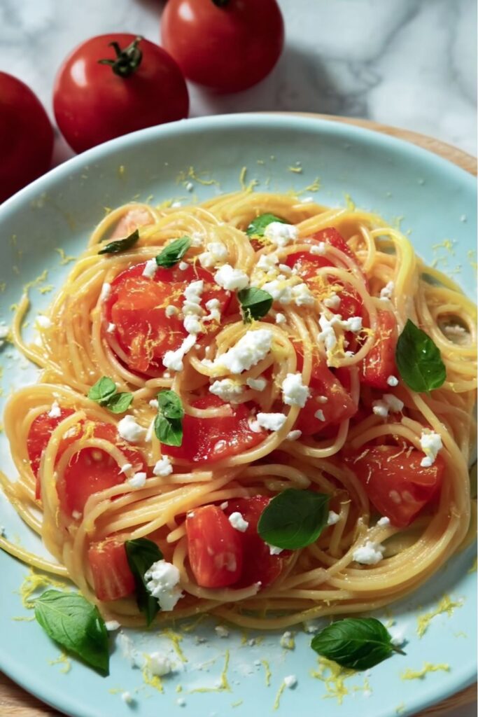 Spaghetti with fresh tomatoes, basil, and cheese in bowl, Stanley Tucci Pasta
