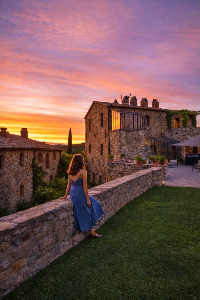 Vineyard Hotels in Tuscany at Castello di Vicarello during sunset with stone terrace