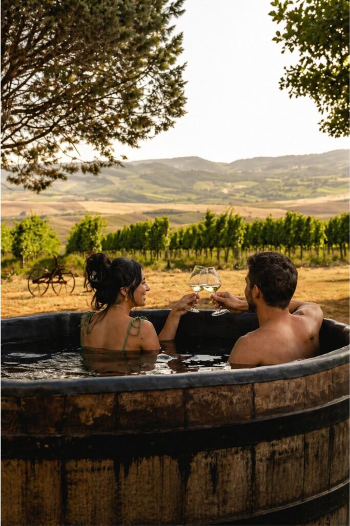 Dreamy Airbnbs in Tuscany at Sce Quirìc with wine tub, vineyards, and Val d’Orcia hills