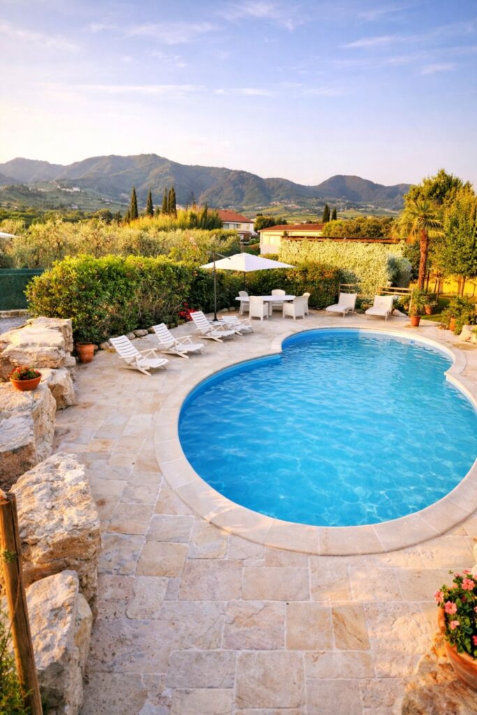 Villa Briciola Villas in Tuscany with Private Pool with curved blue pool, stone terrace, and mountain views