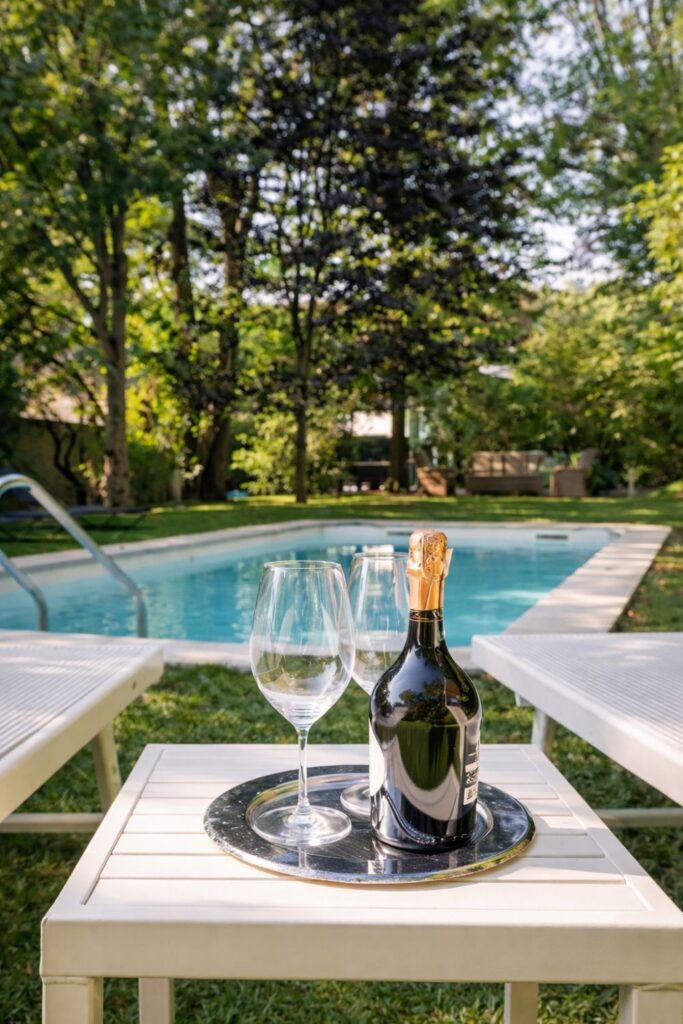 Villa Giardino Lucca Villas in Tuscany with Private Pool with a garden pool, loungers, and trees