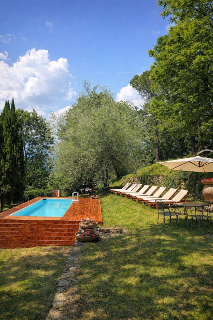 Villa Il Cesto Villas in Tuscany with Private Pool with a raised pool, loungers, and wooded Chianti views