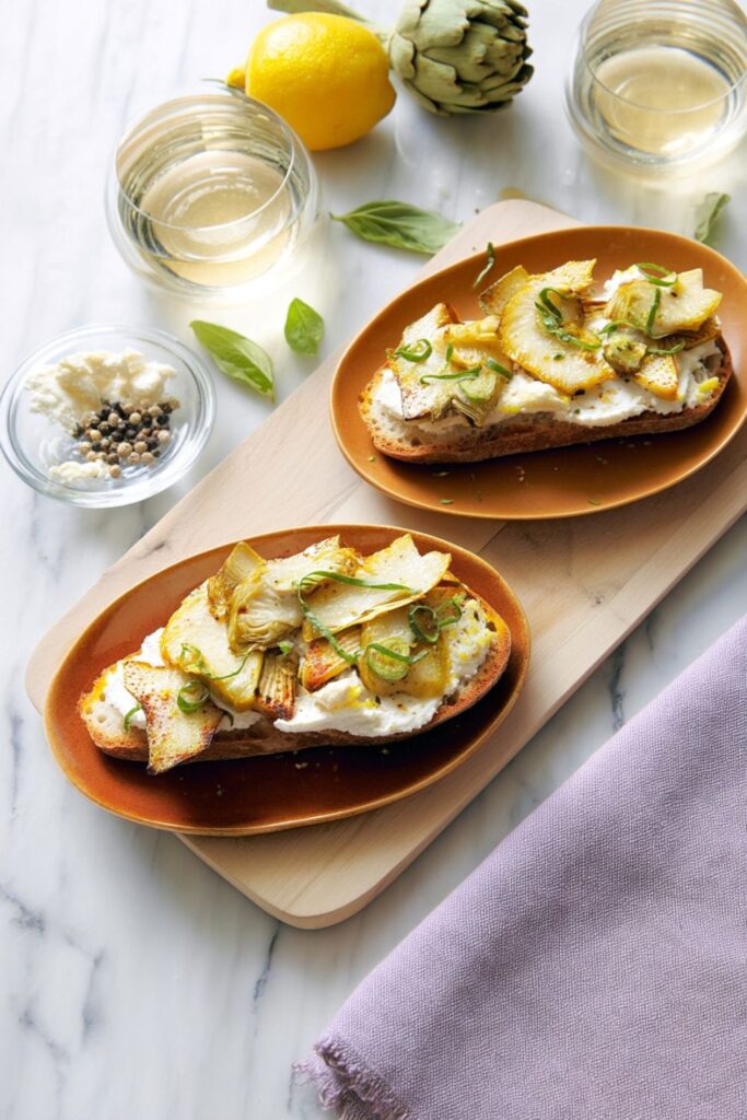 Roasted artichoke and ricotta bruschetta on ciabatta, an elegant choice for 4th of july horderves.