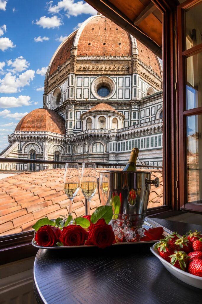 Hotel Duomo terrace scene with cathedral backdrop for Florence Hotels with Duomo Room Views