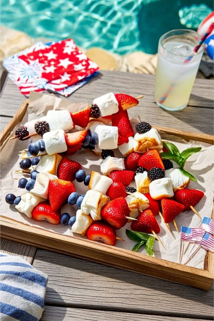 Fruit and marshmallow kabobs on a tray, a perfect Patriotic Summer Snack for the pool.